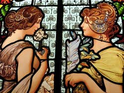 A stained glass window depicting two women